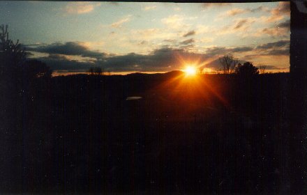 Sunset over hills behind Mother's house